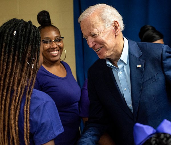 Joe Biden greeting a supporter at a campaign event.