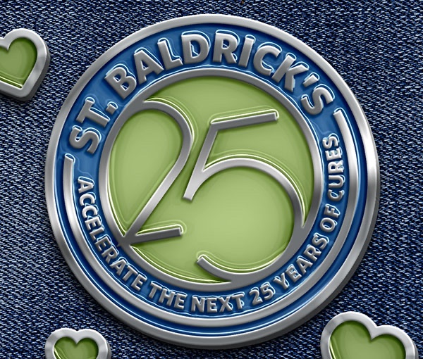 An embossed St. Baldrick's 25th anniversary badge rendered on denim.
