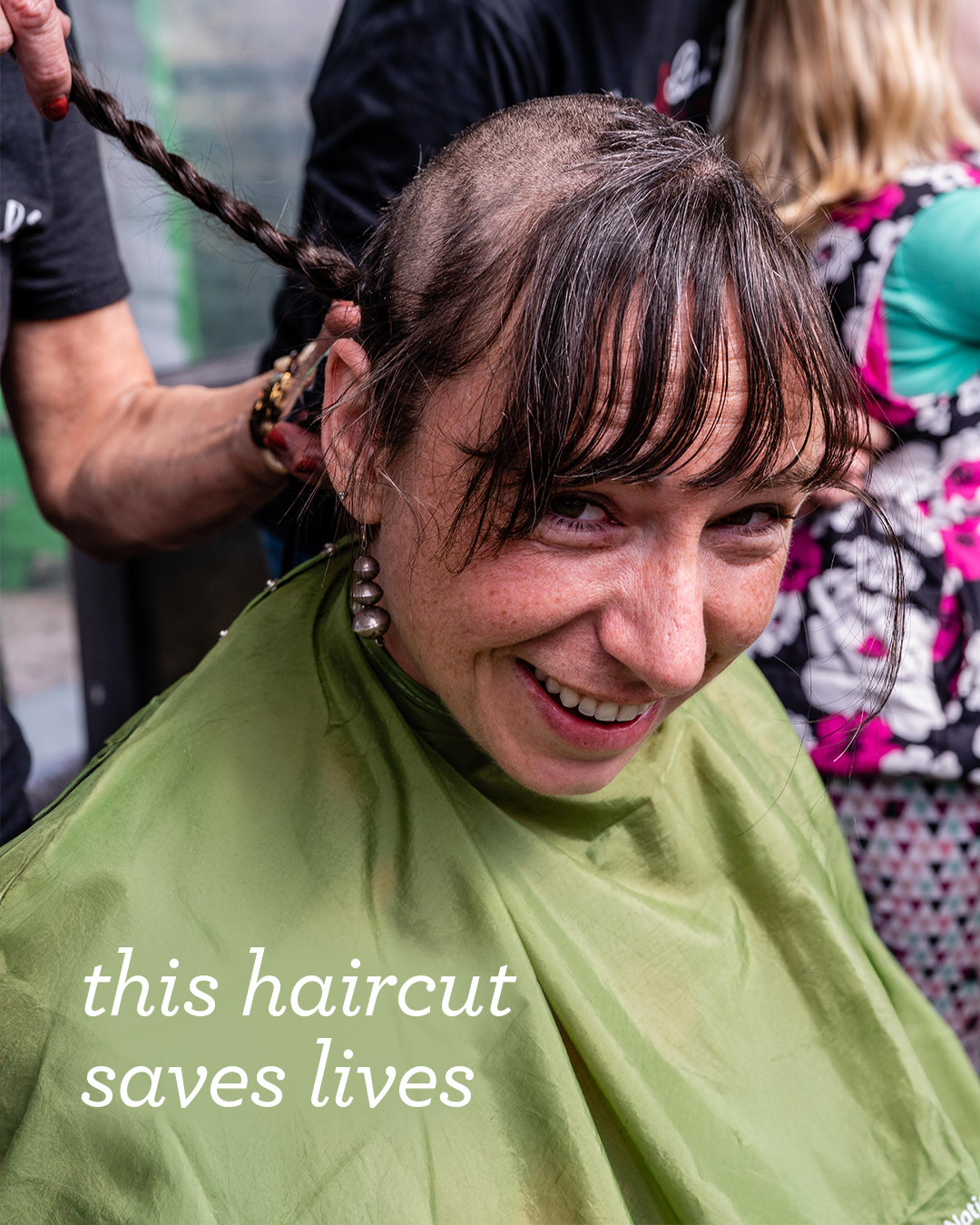 A close-up of a braid being cut off during a St. Baldrick's head-shave.
